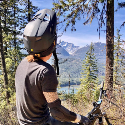Mountain biker stops to look at mountain scenery