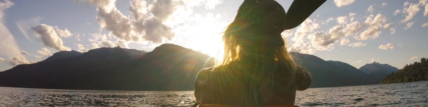 woman kayaking in sunset